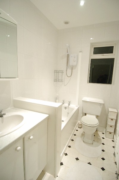 bathroom decorated with white tiles