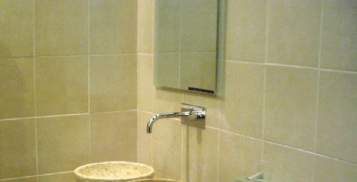 stone coloured tiles used in a bathroom setting